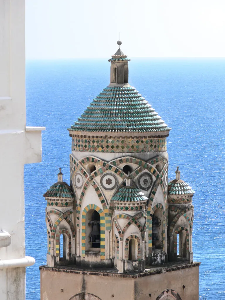 the bell tower of cathedral in Amalfi - Italy - against blue sea