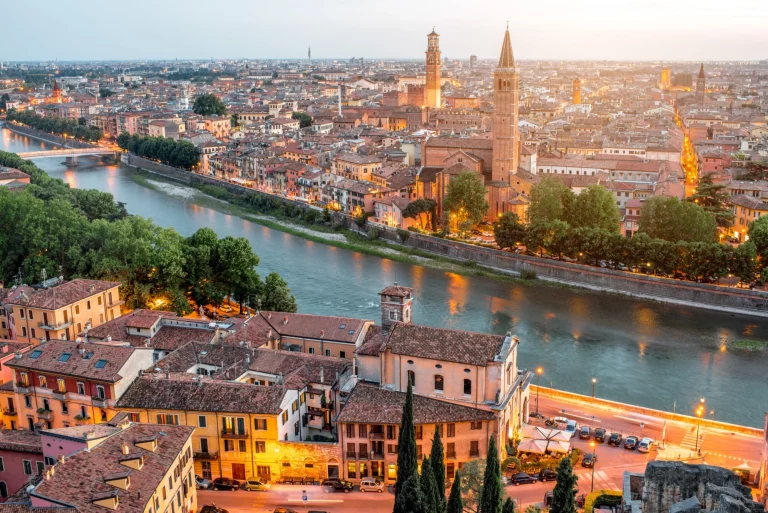 Verona panoramic aerial view on illuminated old town on the sunset in Italy